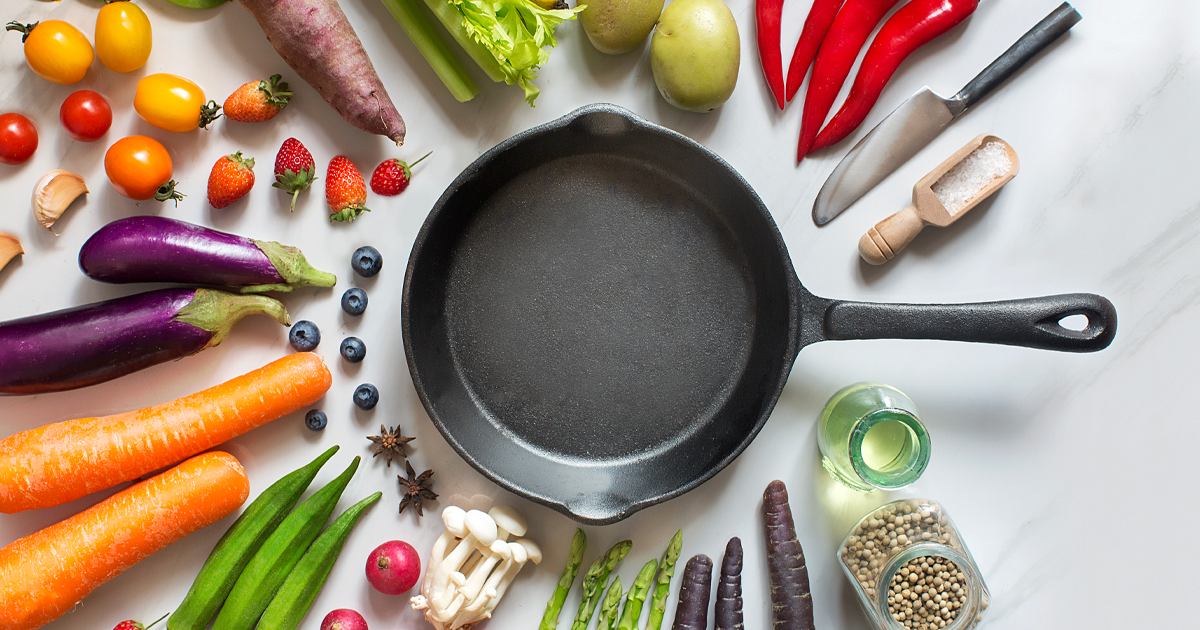 skillet with vegetables circling around it