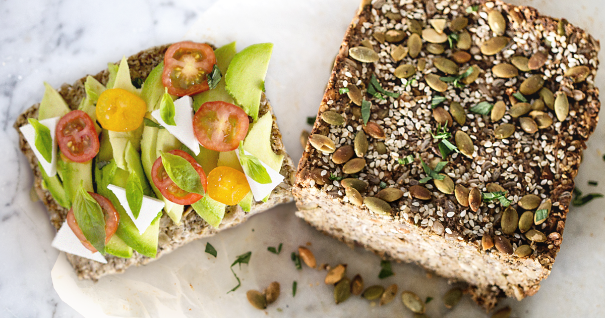 slice of bread with tomatoes and avocados