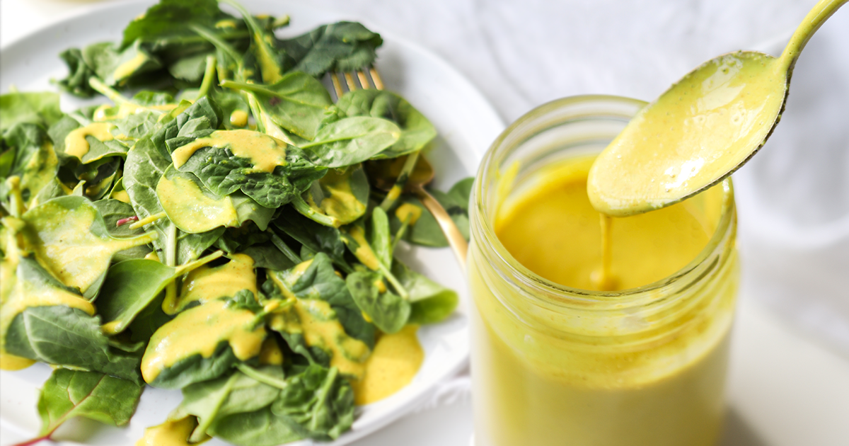 salad with bright yellow dressing